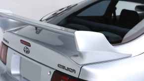 The rear spoiler and badges on a 1990s Toyota Celica