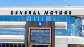 A "General Motors" or GM sign on the outside of a corporate building