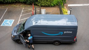 An Amazon delivery driver getting in his van