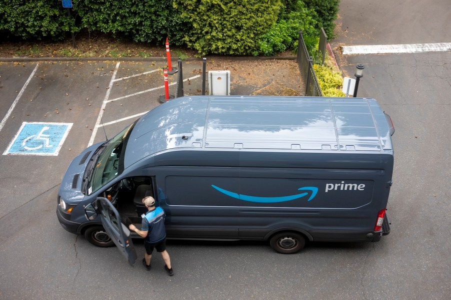 An Amazon delivery driver getting in his van