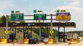 Cars line up to pay to cross a toll bridge