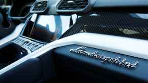 The interior of a Lamborghini Urus, photographed from the passenger's seat