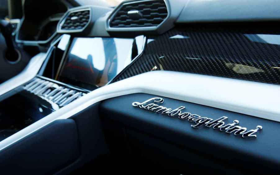 The interior of a Lamborghini Urus, photographed from the passenger's seat