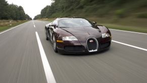 A Bugatti Veyron speeds down a road in central Europe.