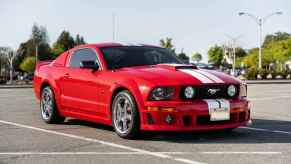 A red 2006 Ford Mustang GT Coupe Roush Stage 1 parked in right front angle view