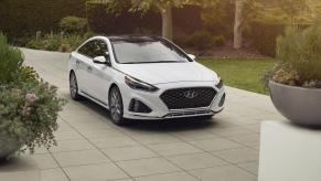 A white 2019 Hyundai Sonata parked in right front angle view