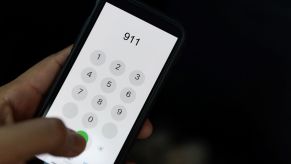 Someone dialing 911 on a smartphone