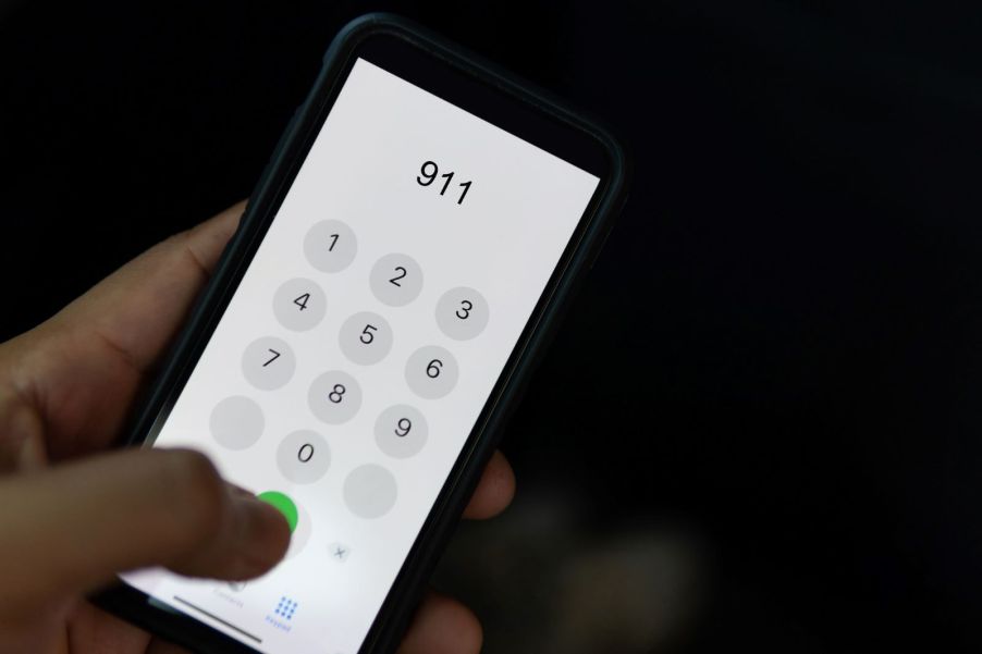 Someone dialing 911 on a smartphone