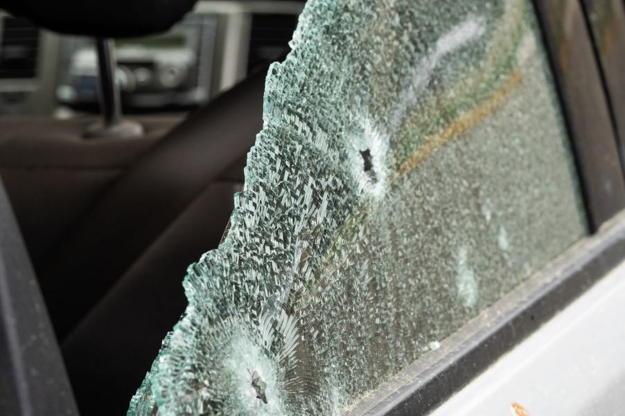 Remaining glass of a smashed rear car window.