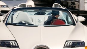 Boxer Floyd Mayweather jr. drives a white Bugatti Veyron through the street of Las Vegas.