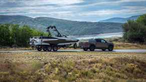 A Nissan Frontier, the deadliest pickup truck in America, towing a boat