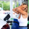 Woman at gasoline station frustrated by diesel fuel mixup.