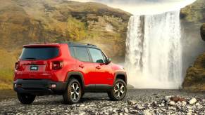 A 2021 Jeep Renegade, one of the vehicles on a current recall, by a waterfall.