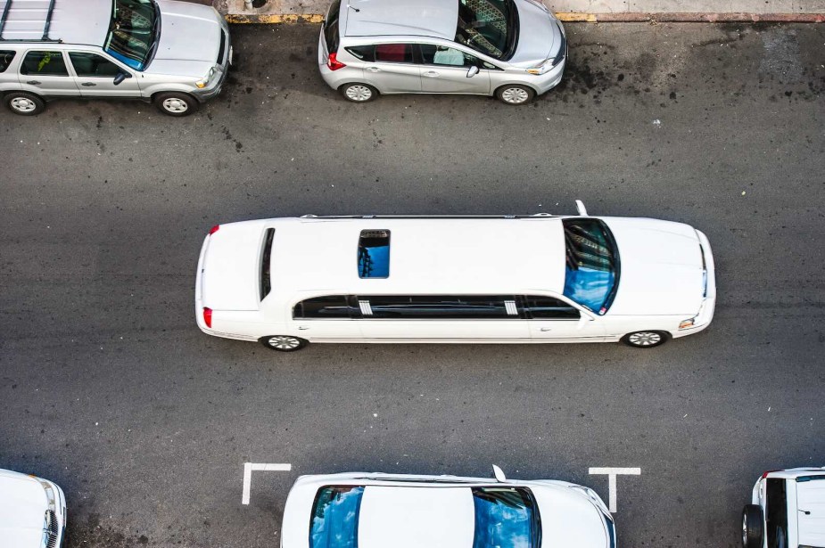 Overhead view of a white limousine in a city