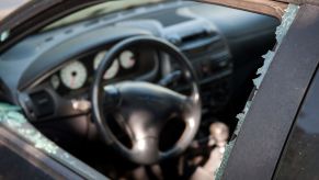 The interior of a car from the viewpoint of a broken glass