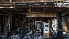 The inside of a burned dealership, showcasing the damage