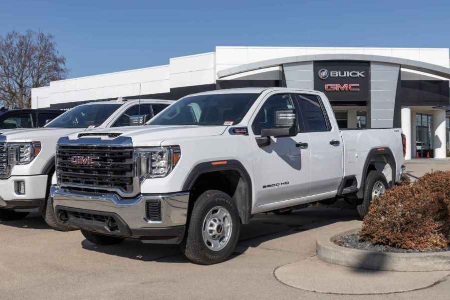 A 2024 GMC Sierra 2500 HD pickup truck parked in a dealership lot