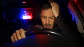 A man being pulled over by the police