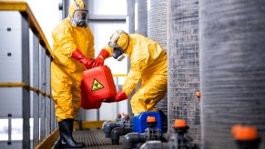 Two men in hazmat suits