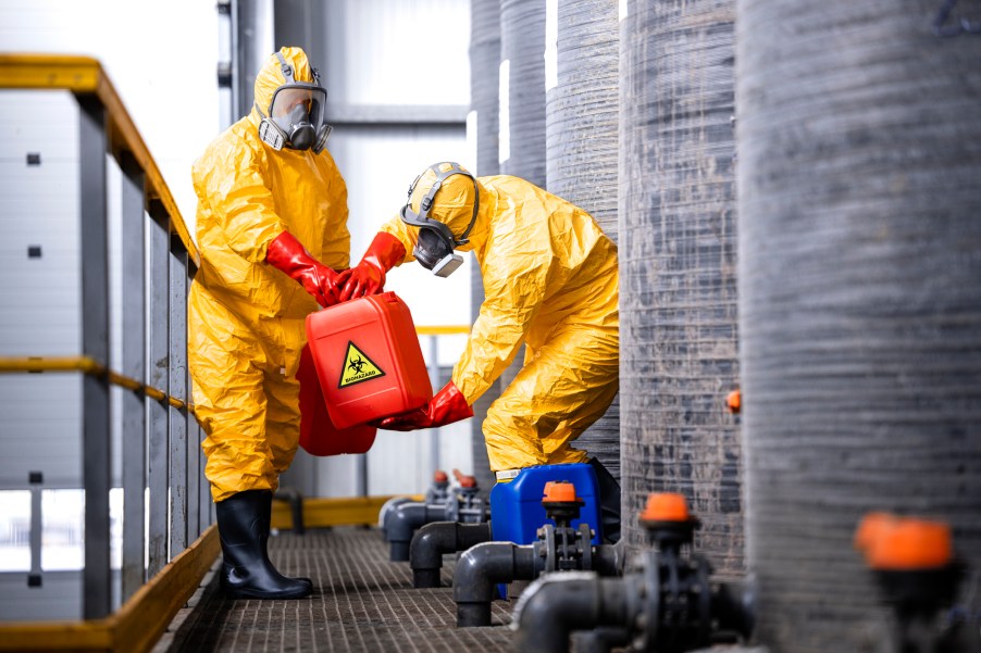 Two men in hazmat suits