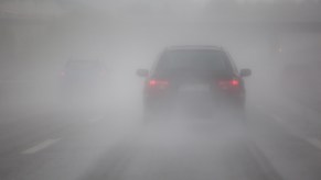 A car driving in fog on the highway