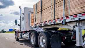 Lumber truck loaded with cut plans