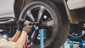 A mechanic fixing a customer's tires