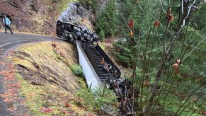 Overturned semi-truck carrying pesticides on a remote National Forest road