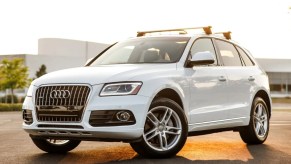 A white 2015 Audi Q5 SUV parked in left front angle view