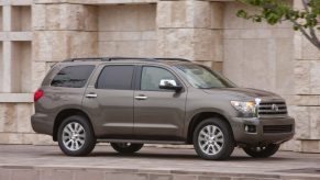 A brown metallic 2017 Toyota Sequoia parked in right side angle view