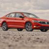 A red 2019 Volkswagen Jetta parked in right front angle view | VW