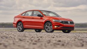 A red 2019 Volkswagen Jetta parked in right front angle view | VW