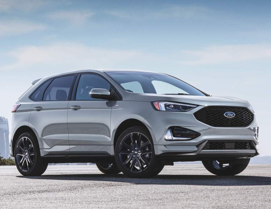 A silver 2020 Ford Edge parked in right front angle view