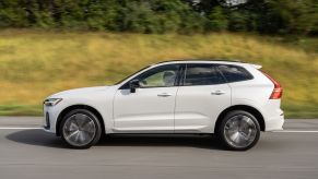 A white 2022 Volvo CX60 SUV driving in full left profile view, Volvo was named one of the least-complained about automakers in the U.S.