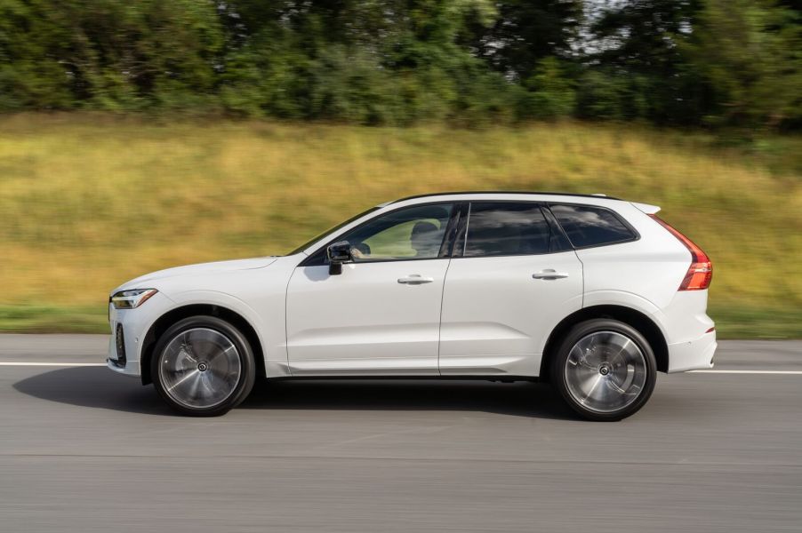 A white 2022 Volvo CX60 SUV driving in full left profile view, Volvo was named one of the least-complained about automakers in the U.S.