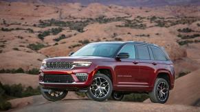 A 2024 Jeep Grand Cherokee parked on top of a desert hill