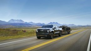 A 2025 Chevrolet Silverado 1500 hauling a trailer