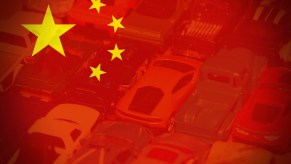 Chinese flag imposed over a car lot.