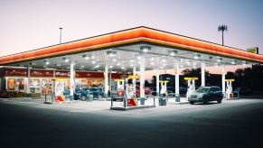 A lit gas station at night is a common source of car theft, despite the lights.