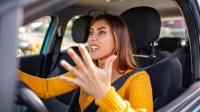 Driver frustrated at her cities gridlock traffic issue.