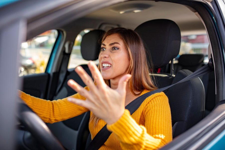 Driver frustrated at her cities gridlock traffic issue.