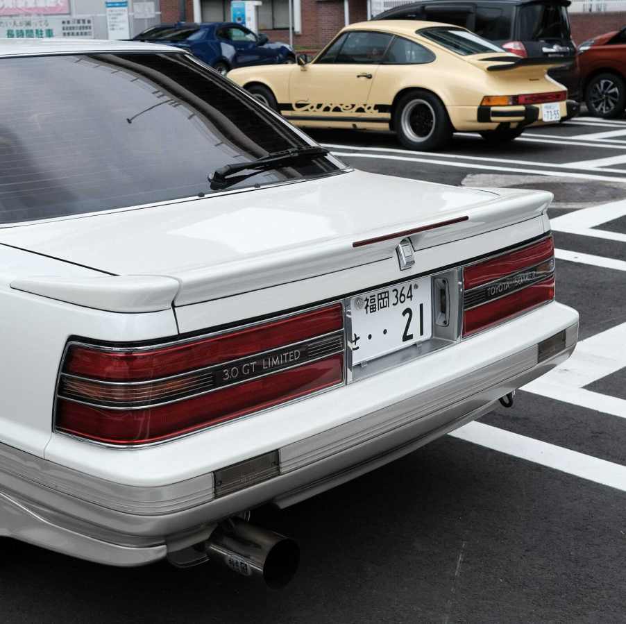 The rear of a white Toyota Soarer GT coupe