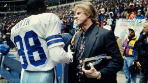 Gary Busey, the actor who helped create the California helmet laws, at a football game.