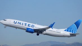 Almost 200 plane passengers were delayed on a United flight after a man become so intoxicated that he urinated on himself.