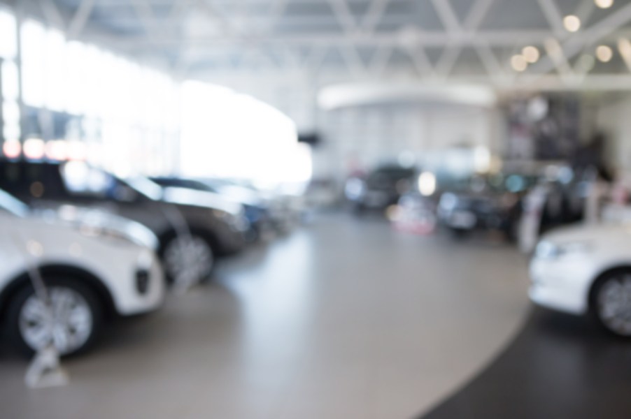 Car dealership sales floor blurred