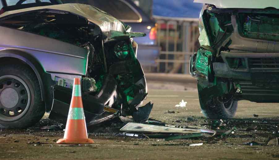 two cars in a car accident looking like it's in the middle of an intersection