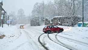 A car sliding on black ice during a snow storm