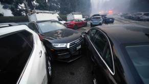 The aftermath of a bulldozer moving abandoned cars on Sunset Blvd during the Palisades fire in LA