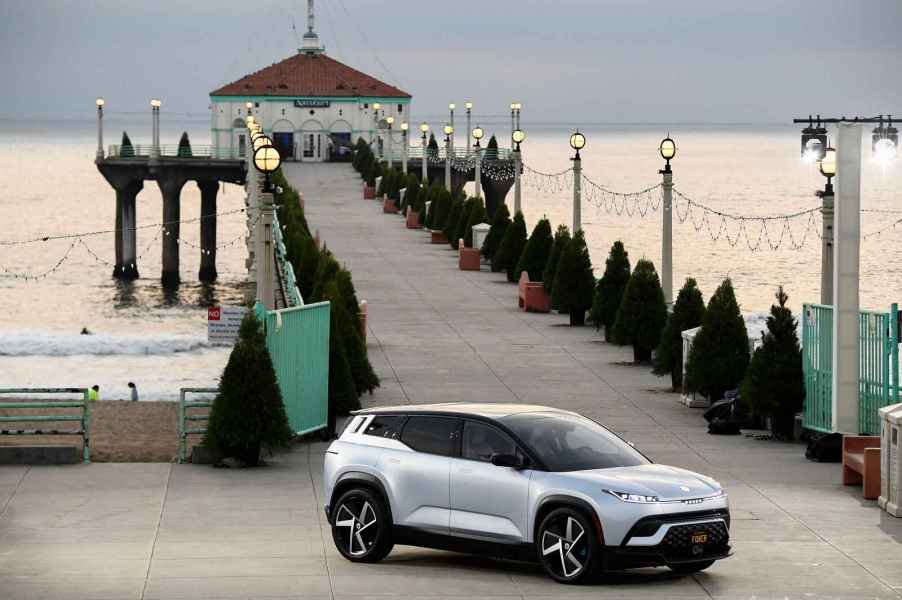 A Fisker Ocean EV SUV parked at a pier entrance in Los Angeles in 2021. The Ocean was the Consumer Reports car test team's least favorite fleet car of 2024