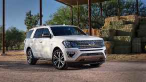 A white Ford Expedition parked in right front angle view